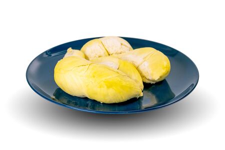 Durian that has been peeled from the skin and placed on a plate is ready to eat, isolated on white background.の写真素材