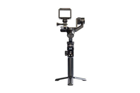 Action camera is mounted on a 3-axis motor stabilizer for smooth video recording isolated on white background.の写真素材