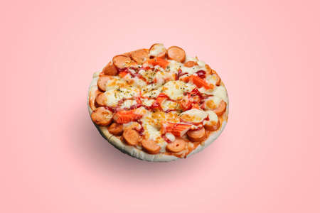 Sausage and Crab Stick Pizza isolated on pastel color background.の写真素材