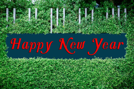 Happy new year texts on the framed by green leaves, use happy new year concept.の写真素材