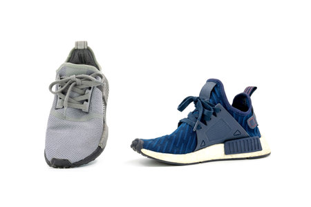 Gray and blue colors fashion sport shoes isolated on white background.の写真素材