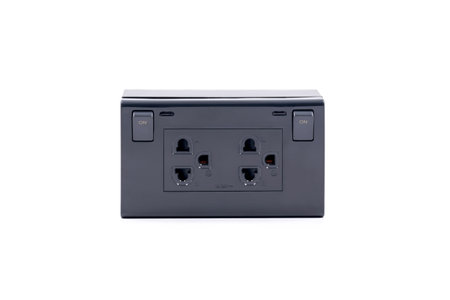 Black color wall outlet AC power plug socket with On-Off switch isolated on white background.の写真素材