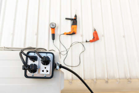 Close-up of silver colored trailer plug 4 sockets  on the roof for use with hand tools.の写真素材