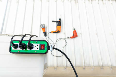 Close-up of green color trailer plug 4 sockets with on-off switch for use with hand tools.の写真素材