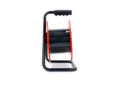 Empty red extension cord reel isolated on white background.の写真素材