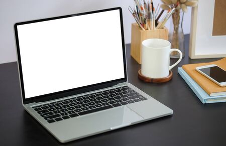 Workspace desk and laptop. copy space and blank screen. Business image, Blank screen laptop and supplies.の写真素材