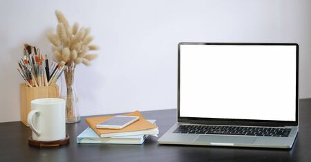 Workspace desk and laptop. copy space and blank screen. Business image, Blank screen laptop and supplies.の写真素材
