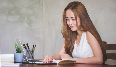 Portrait businesswoman using laptop for work on work space.