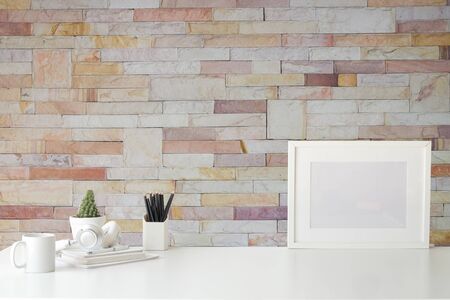 Mockup workspace desk and copy space books,plant and coffee on wood desk.の写真素材