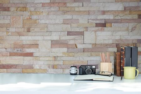 Mockup workspace desk and copy space books,plant and coffee on wood desk.の写真素材