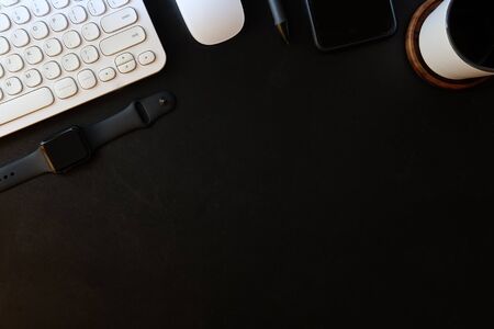 Top view white office desk table with blank notebook, computer keyboard and other office supplies. with copy space, flat lay.の写真素材