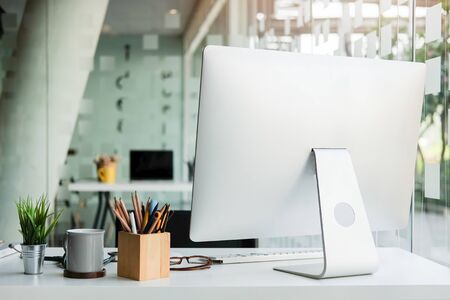 Office desk Workspace stuff with notepad, laptop and coffee cup mouse notepad shot.の写真素材