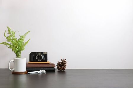 Mockup workspace desk and copy space books,plant and coffee on wood desk.の写真素材