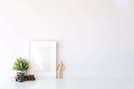 Mockup workspace desk and copy space books,plant and coffee on white desk.の写真素材