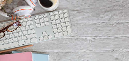 Top view office stuff with notepad, laptop and coffee cup mouse notepad shot.blank screen mobile...