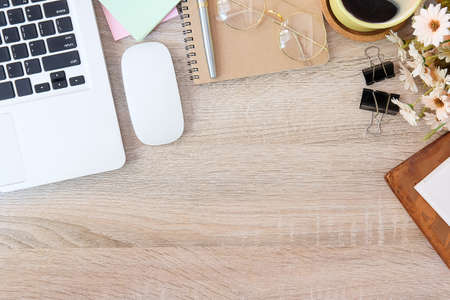 Top view office stuff with notepad, laptop and coffee cup mouse notepad shot.blank screen mobile...