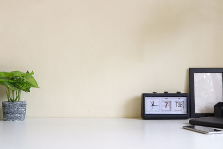 Mockup workspace desk and copy space books,plant and coffee on white desk.の写真素材