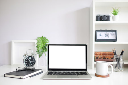 Workspace desk and laptop. copy space and blank screen. Business image, Blank screen laptop and supplies.の写真素材