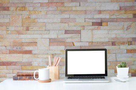 Workspace desk and laptop. copy space and blank screen. Business image, Blank screen laptop and suppliesの写真素材