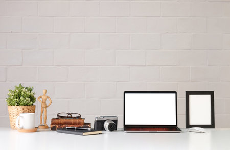 Workspace desk and laptop. copy space and blank screen. Business image, Blank screen laptop and suppliesの写真素材
