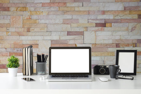 Workspace desk and laptop. copy space and blank screen. Business image, Blank screen laptop and supplies.の写真素材