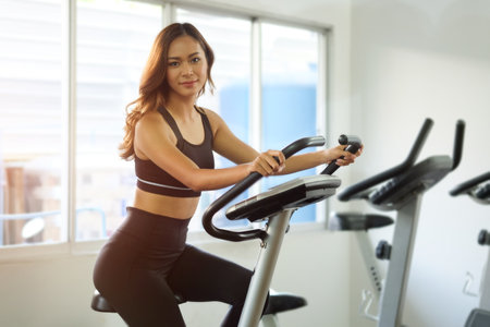 Women exercises warming up with weights in Gym health club in gym, concept.