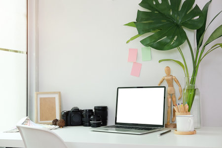 Workspace desk and laptop. copy space and blank screen. Business image, Blank screen laptop and supplies.の写真素材