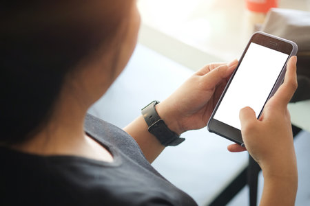 Close up of man using mobile smartphone at home, He searching or social networks.の写真素材