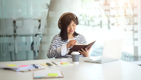 Experienced businesswoman reading publication via laptop computer making research for planning...