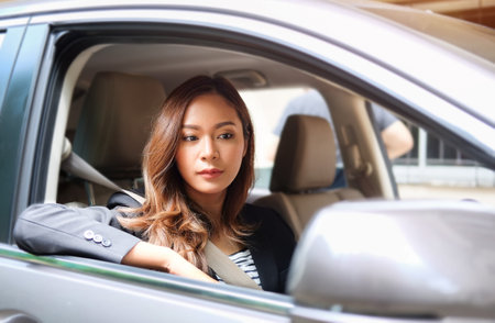 Attractive Businesswoman driving a car.の写真素材