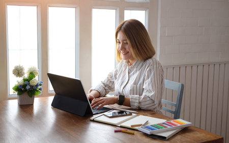 Portrait businesswoman using laptop for work on work space.の写真素材