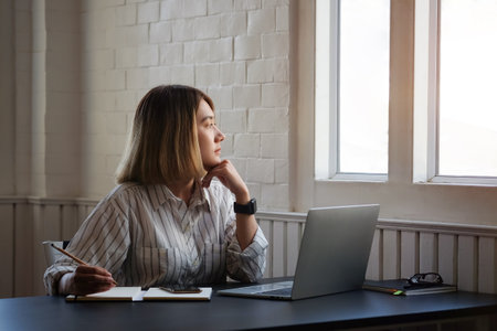 Portrait businesswoman using laptop for work on work space.の写真素材