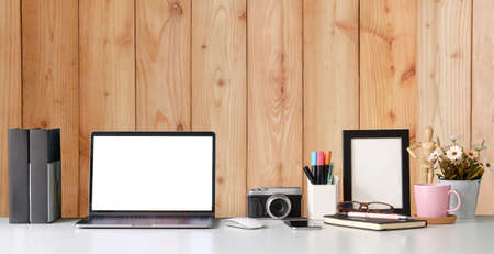 Modern workspace with computer with blank screen and equipment on white table.Blank screen for your information.の写真素材