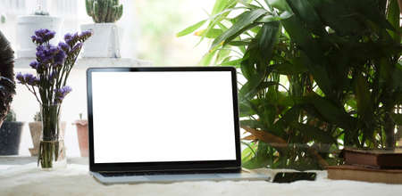 Modern workspace with computer with blank screen and equipment on white table.Blank screen for your information.の写真素材