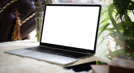 Modern workspace with computer with blank screen and equipment on white table.Blank screen for your...