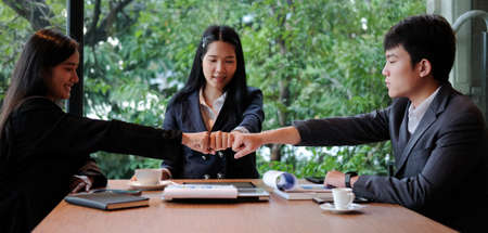 Business people discussing their project in meeting room at modern office.