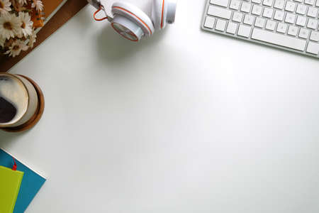 Top view office stuff with notepad, laptop and coffee cup mouse notepad shot.blank screen mobile...