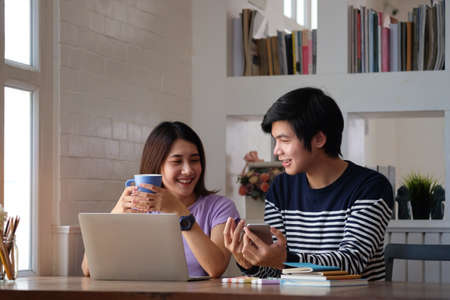 Two young designer working with computer laptop at creative workplace.の写真素材