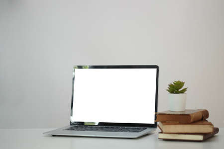 Modern workspace with computer with blank screen and equipment on white table.Blank screen for your information.の写真素材