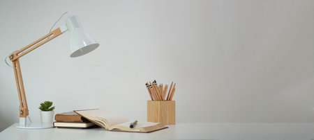 Mockup workspace desk and copy space book,plant and coffee on wood desk.の写真素材