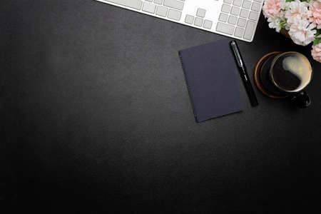 Top view office stuff with notepad, laptop and coffee cup mouse notepad shot.blank screen mobile phone and supplies on desk workspace and copy space.の写真素材