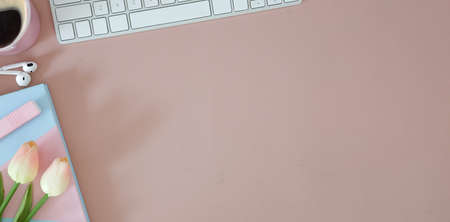 Top view office stuff with notepad, laptop and coffee cup mouse notepad shot.blank screen mobile phone and supplies on desk workspace and copy space.の写真素材