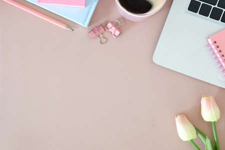 Top view office stuff with notepad, laptop and coffee cup mouse notepad shot.blank screen mobile phone and supplies on desk workspace and copy space.の写真素材
