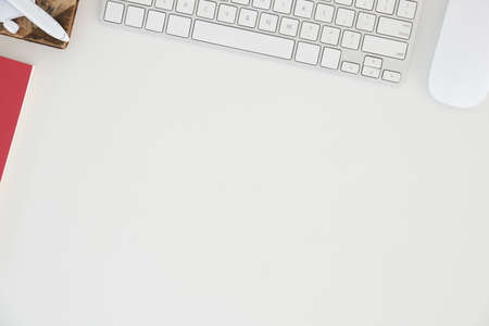 Top view office stuff with notepad, laptop and coffee cup mouse notepad shot.blank screen mobile phone and supplies on desk workspace and copy space.の写真素材