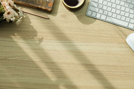 Top view office stuff with notepad, laptop and coffee cup mouse notepad shot.blank screen mobile phone and supplies on desk workspace and copy space.の写真素材