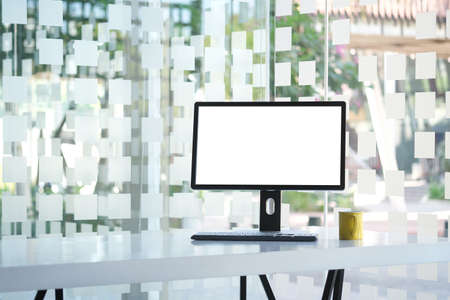 Mock up Copy Space Blank Screen workspace with computer laptop on table.