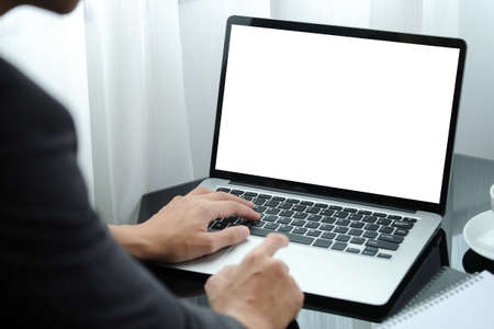 Cropped shot businessman using computer laptop at office.