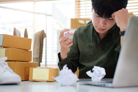 Startup small business entrepreneur  feeling stress about his business result.の写真素材
