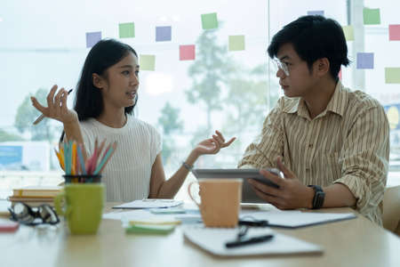 Young businesspeople discussing and planning startup project together.の写真素材