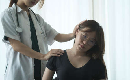 Shot of physiotherapist doing treatment with patient in clinic. Physiotherapy rehab, injury recovery and healthcare concept.の写真素材